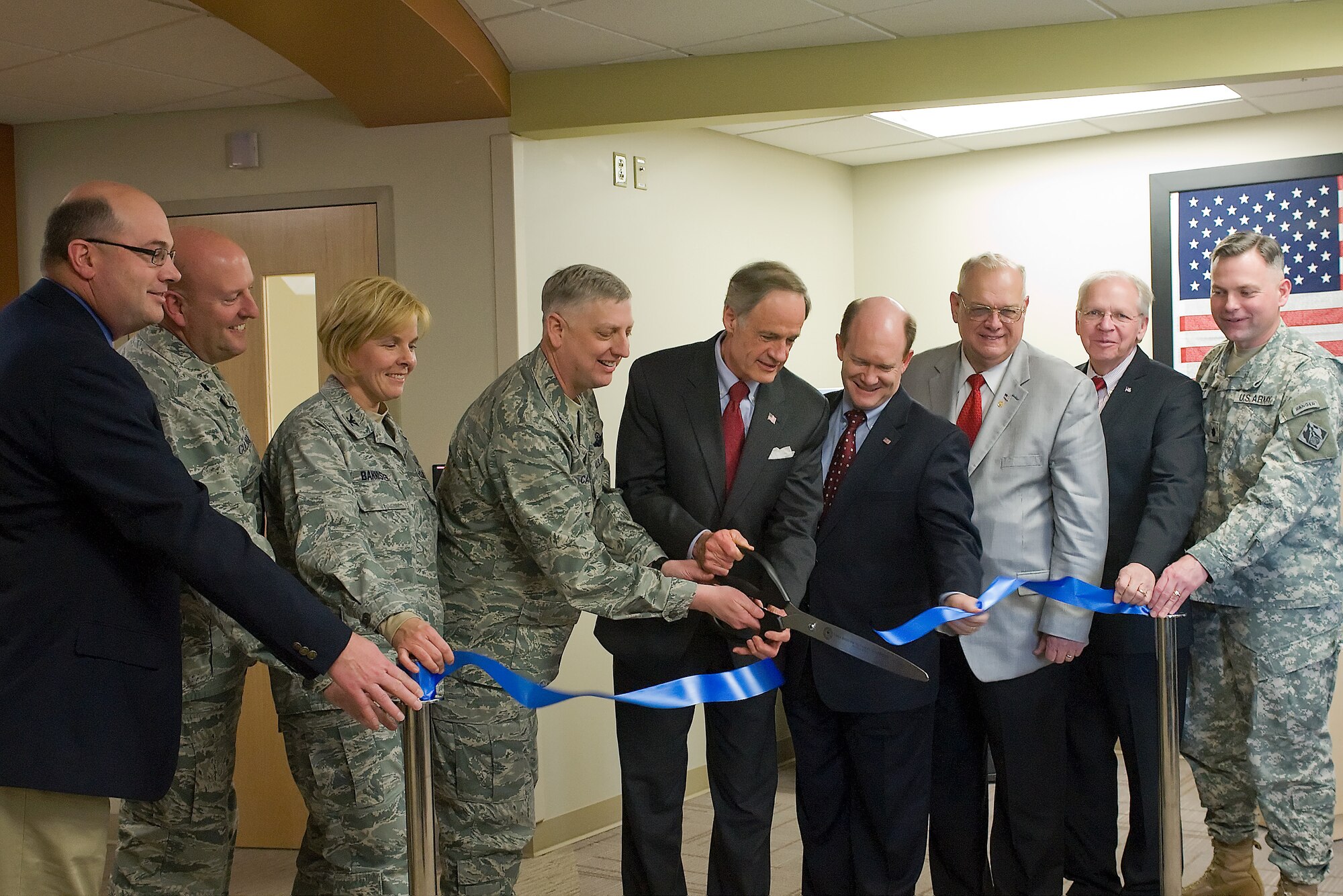 Craig Sterns, left, Lt. Col. Gregory Cullison, Col. Sharon Bannister, Col. Mark Camerer, U.S. Sen. Tom Carper, U.S. Senator Chris Coons, Dover, Del., Mayor Carleton Carey, Mr. John Stickels, and Lt. Col. Philip Secrist cut the ribbon during the opening of the 436th Airlift Wing's newly-renovated medical clinic Feb. 03, 2012, at Dover Air Force Base, Del. The guests took a tour of the facilities to see the upgrades to the medical clinic. (U.S. Air Force photo by Steve Kotecki)