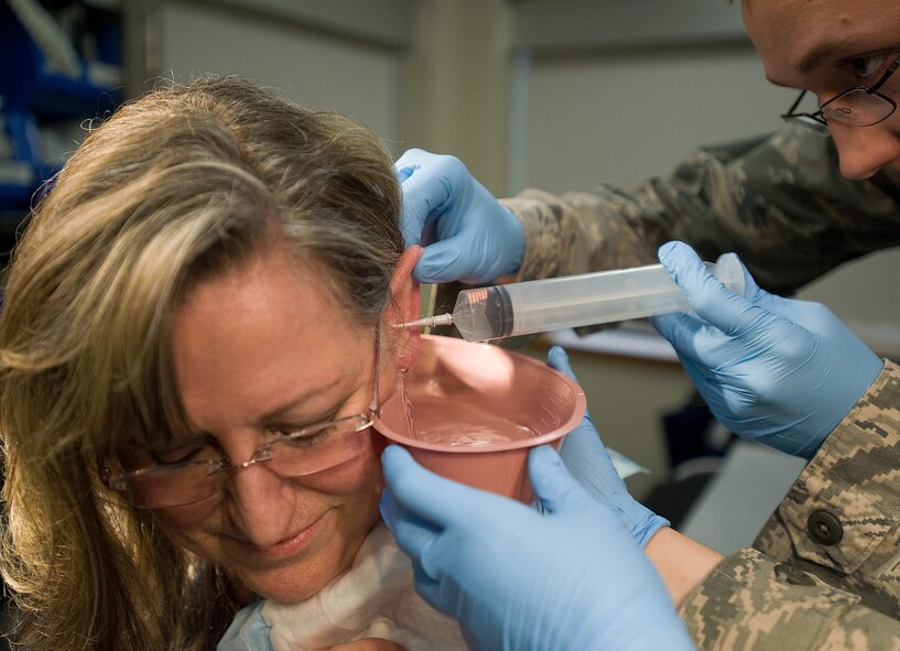 Cynthia Kruener has her ear canal washed Feb. 2, 2012, during a routine visit to the medical clinic at Dover Air Force Base, Del. Kruener underwent this process in one of many newly-renovated procedure rooms. (U.S. Air Force photo by Senior Airman Jacob Morgan) 