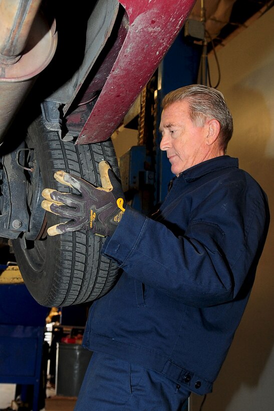 Bill Neff, Automotive Service shop mechanic, replaces a tire on a customer’s vehicle at Fort Eustis, Va., Feb. 1, 2012. The service center is open from 8 a.m. to 5 p.m., Monday through Friday. (U.S. Air Force photo by Staff Sgt. Ashley Hawkins/Released)