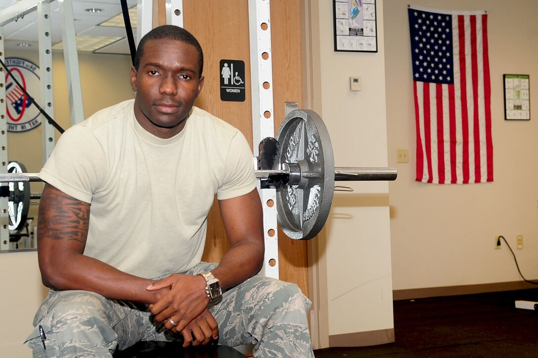 Airman 1st Class Ugochukwu Nwosu works out in the 1st Operations Support Squadron intelligence building in his spare time at Langley Air Force Base, Va. The 26-year-old is a native of Lagos, Nigeria, and enlisted into the Air Force to "give back to the country that did so much" for him. He is currently pursuing his commission into the Army in the "Blue-to-Green" program. (U.S. Air Force photo by Staff Sgt. Ashley Hawkins/Released)