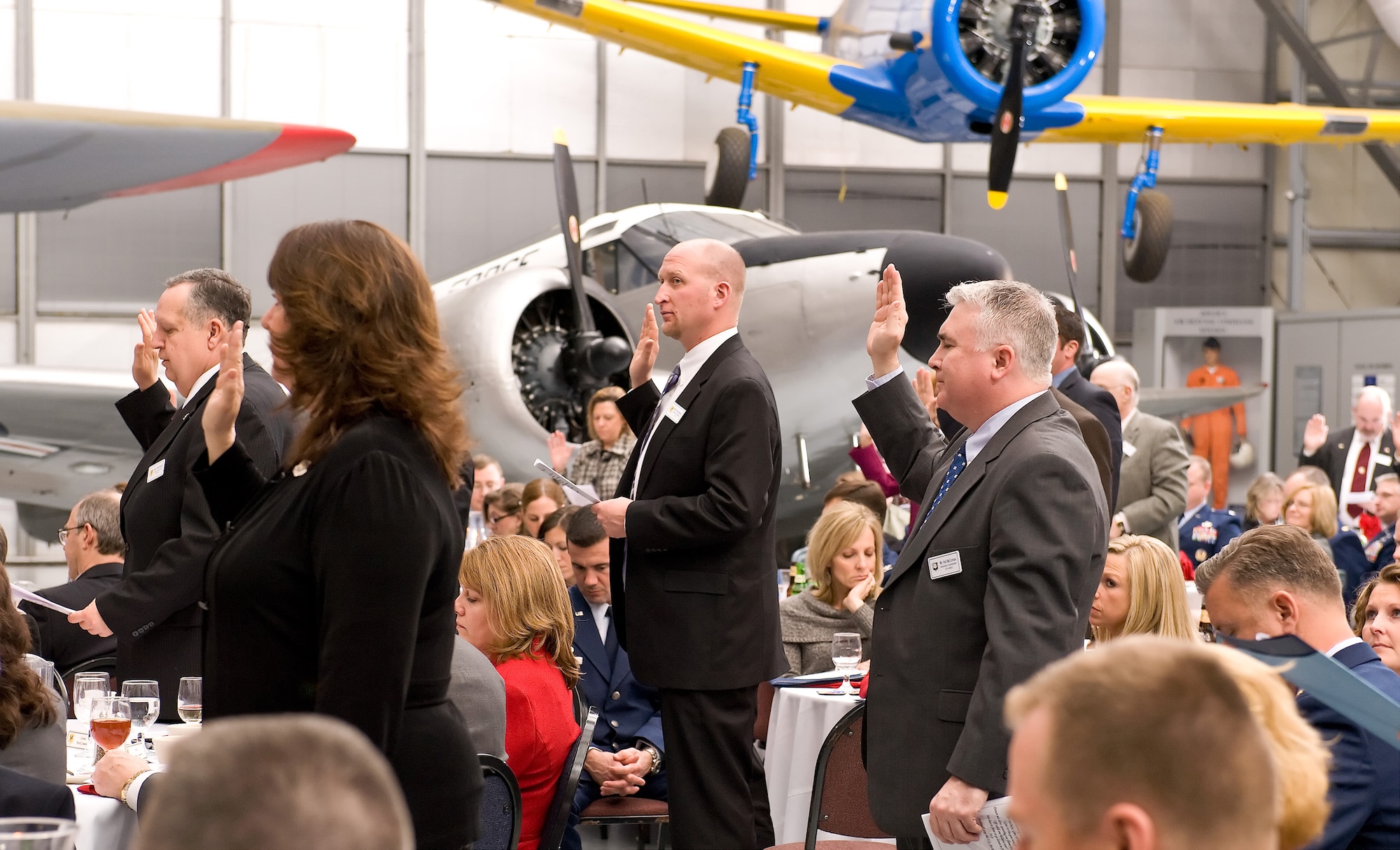 Local community leaders swear the Team Dover Honorary Commander Oath during the Honorary Commander Induction Ceremony Feb. 4, 2012, at the Dover Air Force Base, Del., Air Mobility Command Museum. The oath indicates the new honorary commanders' intent to support the men and women of Dover AFB, the Air Force and the state of Delaware. (U.S. Air Force photo by Roland Balik)