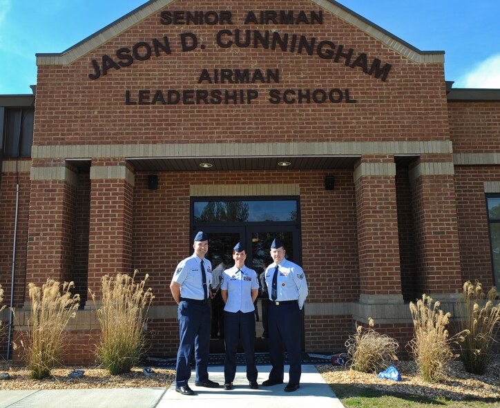 U.S. Air Force Senior Master Sgt. Gina Thursby and Staff Sgts. Virgel Coffman and Michael Youngblood, 23d Force Support Squadron Senior Airman Jason D. Cunningham Airman Leadership School staff members, gather for a group photo outside the ALS building at Moody Air Force Base, Ga., Jan. 30, 2012. The staff was recently selected as the 2011 Air Combat Command Enlisted Professional Military Education Team of the Year for their dedication and hard work in mentoring the Air Force’s future leaders. (U.S. Air Force photo by Airman 1st Class Olivia Dominique/Released)