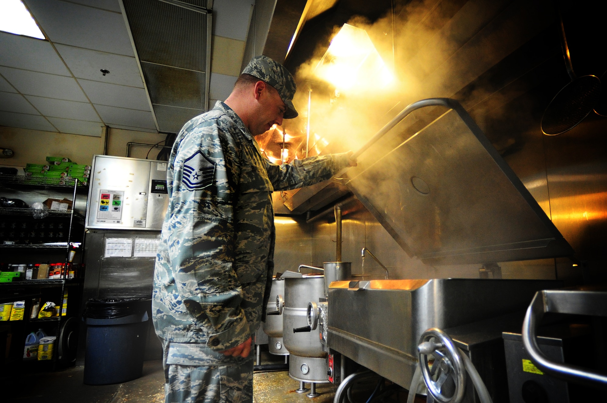 Master Sgt. Dean Burlew, 379th Expeditionary Force Support Squadron dining facility NCO-in-charge, conducts quality assurance checks on food being prepared at the Manhattan Heights Dining Facility here Feb. 4, 2012. The dining facility provides more than 3,600 meals per day to all U.S service members and coalition partners deployed here. Burlew is a native of Millville, N.J. and is deployed from the New Jersey Air National Guard (U.S. Air Force photo/Tech. Sgt. DeNoris A. Mickle)