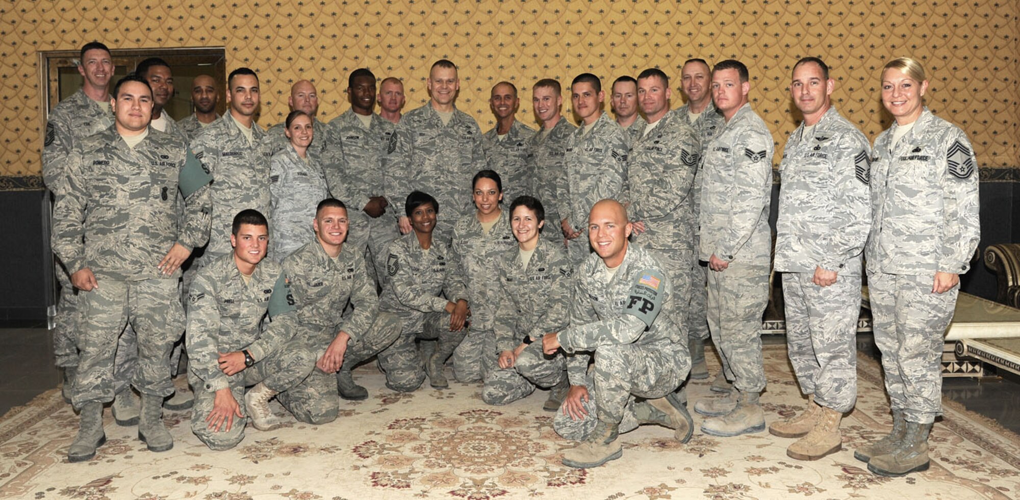 SOUTHWEST ASIA - Chief Master Sgt. James Roy takes a group photo at the passenger terminal Feb. 3, 2012. Roy, the chief master sgt. of the Air Force, stopped through on a tour of several deployed locations to speak with Airmen about various issues in the military today and in the future.  (U.S. Air Force photo/Tech. Sgt. Arian Nead)