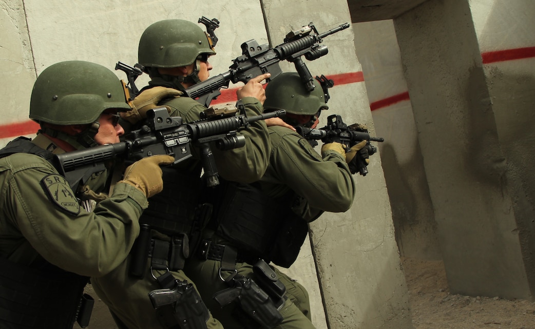 The Combat Center’s Special Reaction Team prepares to enter a building for a dry run of a live fire exercise at Range 111 Feb. 8, 2012.