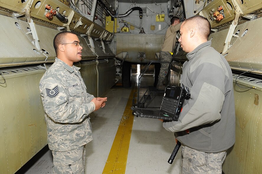 MINOT AIR FORCE BASE, N.D. – Tech. Sgt. Jermaine Wilson (left), 5th Aircraft Maintenance Squadron crew chief, trains a technical sergeant here, Feb. 7.   Wilson recently won the Thomas Barnes Award for contributing the most to the Air Force operational mission. (U.S. Air Force photo/ Airman 1st Class Kristoffer Kaubisch)