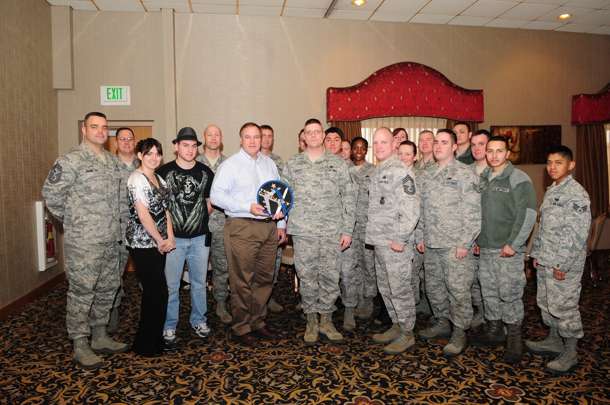 MINOT AIR FORCE BASE, N.D. - Minot's chapter of the Air Force Sergeant's Association presents a Team Minot plaque to Jeffrey Ledoux, the international president of the Air Force Sergeant's Association, during a visit to the Minot AFSA chapter during a luncheon at the Jimmy Doolittle Center here, Feb. 6. During the luncheon, Ledoux discussed what the AFSA does for Airmen and their families and why it's important to speak up and make one's opinion known. AFSA represents professional and personal interests of the total Air Force, including active duty, guard, retired, veterans, and their families. (U.S. Air Force photo/ Senior Airman Jesse Lopez)
