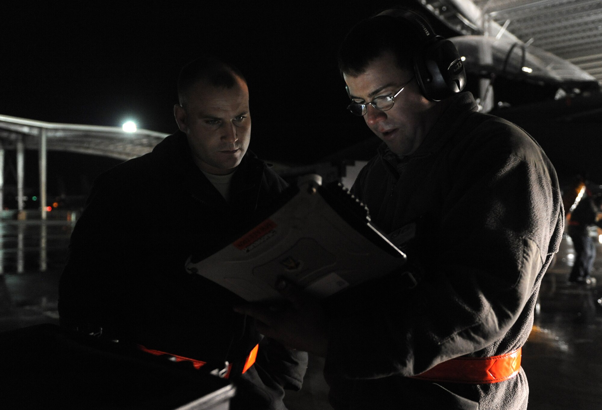 Staff Sgts. Austin Mauch and Randy Drake, 391st Aircraft Maintenance Unit dedicated crew chiefs, consult a technical order before performing maintenance on an F-15E Strike Eagle Feb. 1, 2012 at Mountain Home Air Force Base, Idaho. Crew chiefs are constantly inspecting aircraft ensuring every part is fully operational. “The jets don’t leave the ground until we say it’s okay,” said Drake. “We have a hand in every aspect of these aircraft and nothing goes on without us knowing.”(U.S. Air Force photo by Senior Airman Debbie Lockhart/Released)