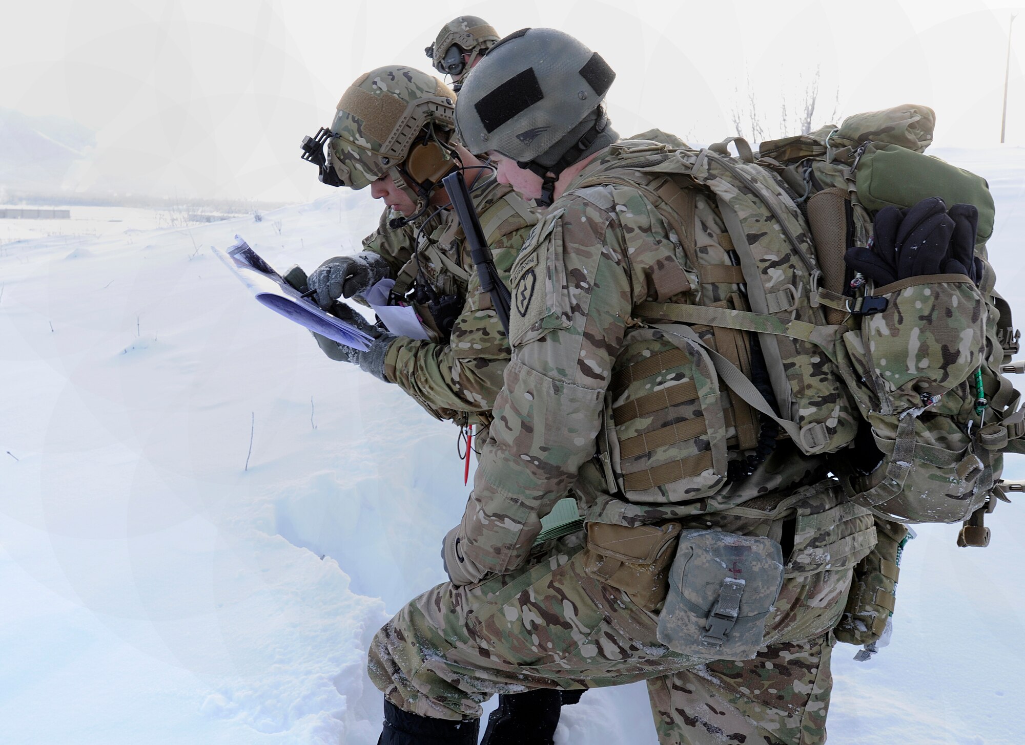 Airman 1st Class Hugo Espinoza, 3rd Air Support Operations Squadron radio operator, maintainer and driver and a native of Miami, Fla., shows Senior Airman Ethan Brown, 3rd ASOS radio operator, maintainer and driver and a native from Pinedale, Wy., where they are and the objective on a map on Joint Base Elmendorf-Richardson Jan. 26, 2012. The 3rd ASOS works hand-in-hand with the 4th Brigade Combat Team (Airborne), 25th Infantry Division. (U.S. Air Force photo/Staff Sgt. Zachary Wolf)