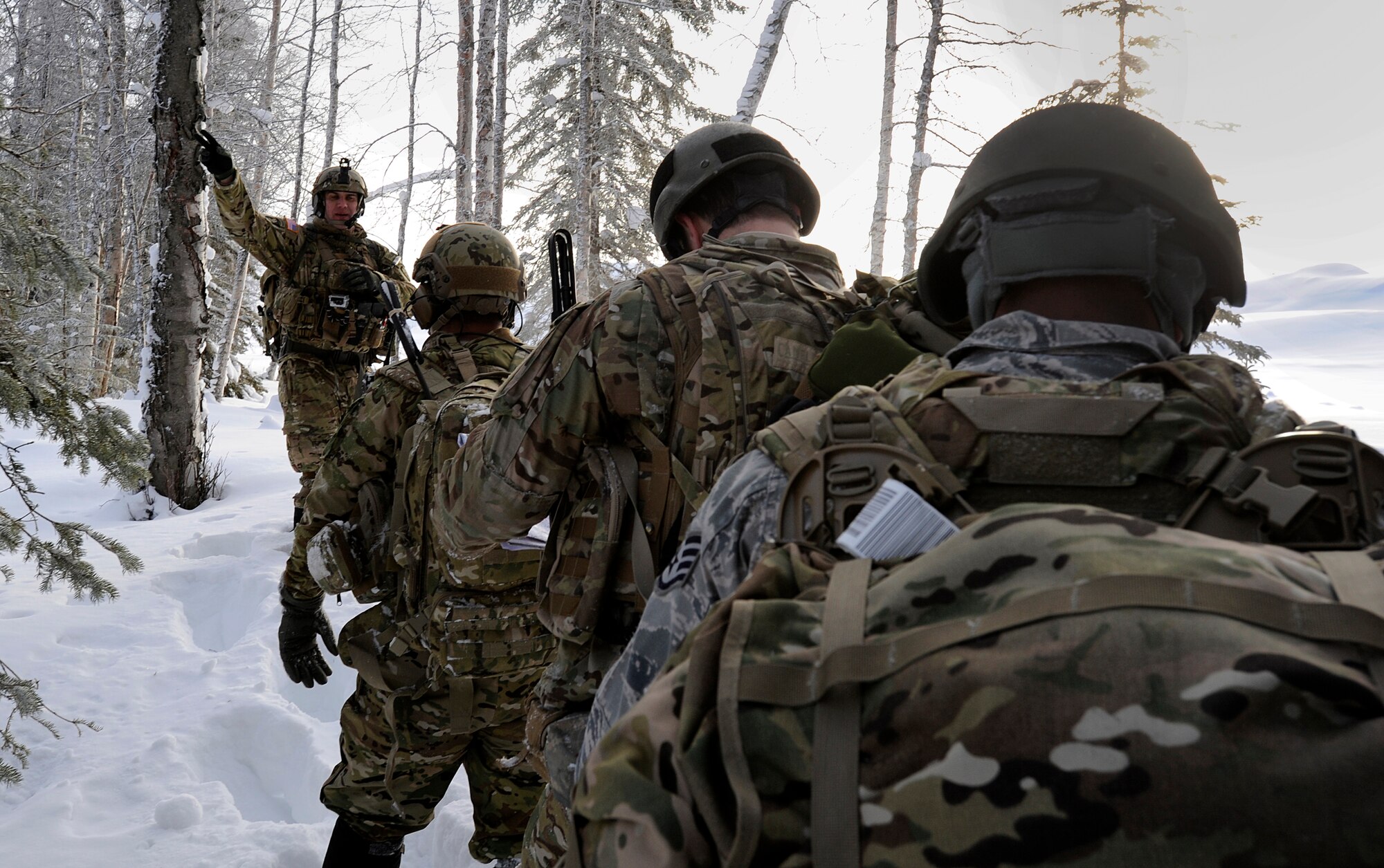 Tech. Sgt. Michael Avellino, 3rd Air Support Operations Squadron joint  terminal attack controller and a native of San Francisco, Ca., turns around to check on the status of the other members of the 3rd ASOS during a training scenario on Joint Base Elmendorf-Richardson Jan. 26, 2012. The 3rd ASOS works hand-in-hand with the 4th Brigade Combat Team (Airborne), 25th Infantry Division. (U.S. Air Force photo/Staff Sgt. Zachary Wolf)