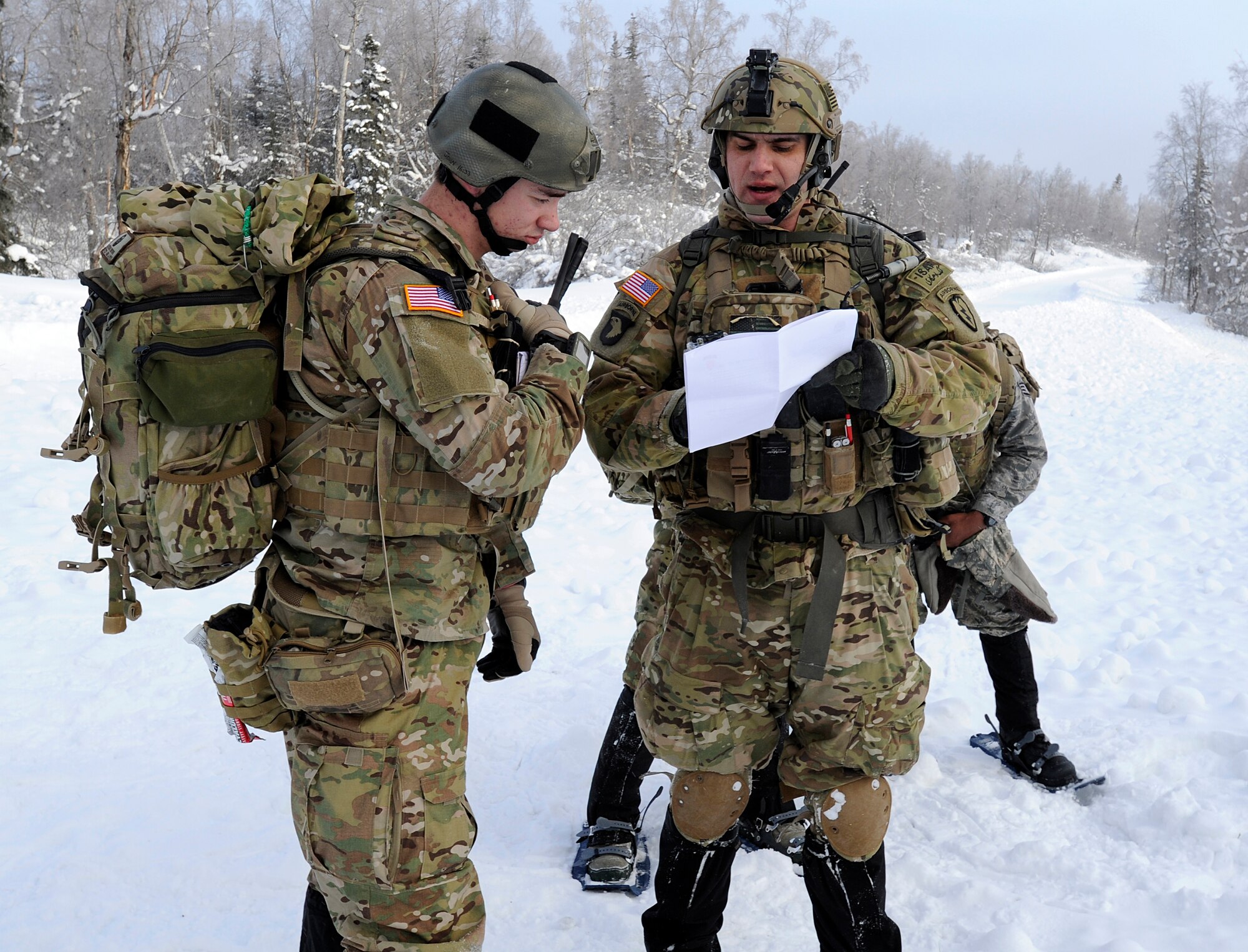 Tech. Sgt. Michael Avellino, 3rd Air Support Operations Squadron joint  terminal attack controller and a native of San Francisco, Ca., shows Senior Airman Ethan Brown, 3rd ASOS radio operator, maintainer and driver and a native from Pinedale, Wy., some details of the training scenario on Joint Base Elmendorf-Richardson Jan. 26, 2012.  The 3rd ASOS works hand-in-hand with the 4th Brigade Combat Team (Airborne), 25th Infantry Division. (U.S. Air Force photo/Staff Sgt. Zachary Wolf)