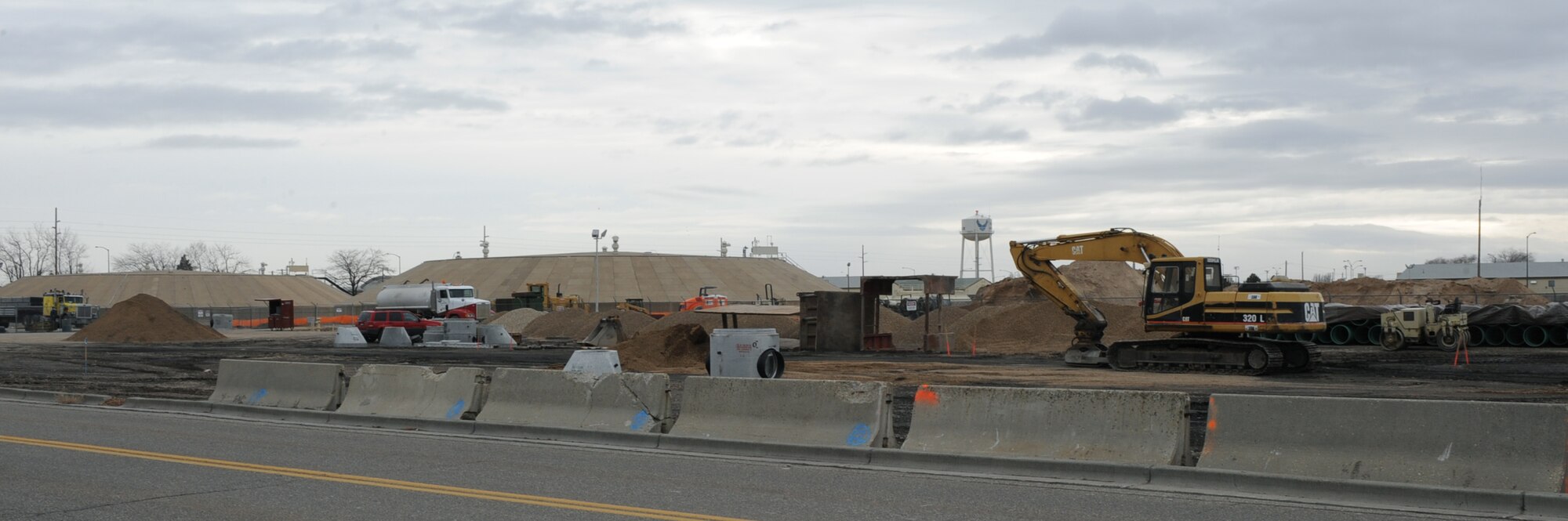 Construction workers lay framework for the new Jet Propulsion 8 fuel tanks Feb. 3, 2012, at Mountain Home Air Force Base, Idaho. The new tanks areas will replace previous ones that have been deemed unserviceable by Defense Logistics Agency. (U.S. Air Force photo by Airman 1st Class Jonathan Glanville/ Released)