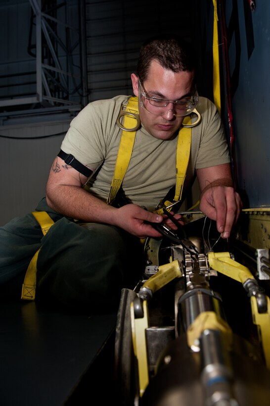 Senior Airman Andrew Knill, 28th Maintenance Squadron hydraulics specialist, safety-wires a bolt on a B-1B integrated servo actuator during a maintenance inspection at Ellsworth Air Force Base, S.D., Feb. 2, 2012. The servo actuator controls the horizontal stabilizers that allow the B-1B to perform tactical maneuvers. (U.S. Air Force photo by Airman 1st Class Kate Thornton/Released) 