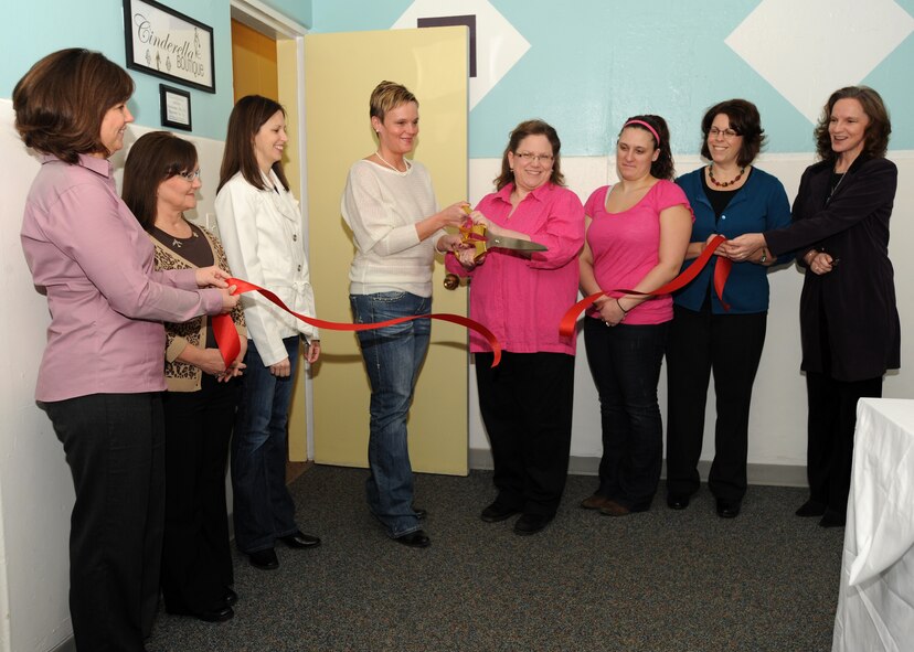 MINOT AIR FORCE BASE, N.D. -- Members of the Cinderella Boutique committee held a ribbon cutting ceremony Feb. 8, for the unveiling of the business located at the Airman's Attic here. The Cinderella Boutique offers the temporary loan of formal and semi-formal wear, party and prom attire, dress shoes and purses to all military personnel and their dependents. The shop opened just in time to meet the needs of the many who plan to attend the upcoming 91st Missile Wing and 5th Bomb Wing Annual Awards Banquets. (U.S. Air Force photo/Senior Airman Jose L. Hernandez)