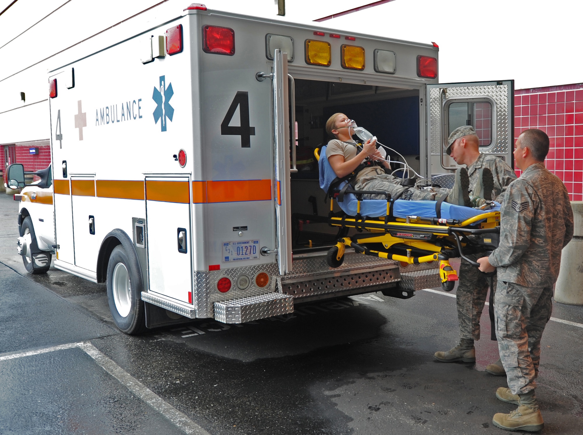 Emergency medical technicians Staff Sgt. Trevor Stevens and Tech. Sgt.
Nicholas Burtcher transport a simulated patient to the emergency room at
David Grant USAF Medical Center. The primary goal of the emergency
department is to provide intensive care for the critically ill or injured
patients. (U.S. Air Force photo/ Staff Sgt. Liliana Moreno)
