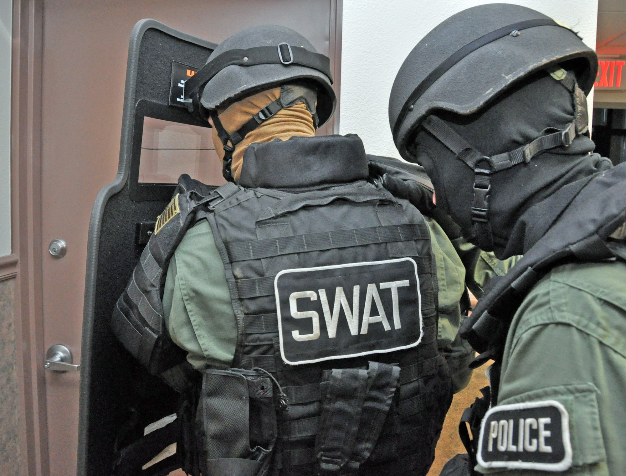 Two Travis SWAT team members demonstrate how thy would form up behind a shield before entering a room Feb. 7 on base. (U.S. Air Force photo/Staff Sgt. Patrick Harrower)
