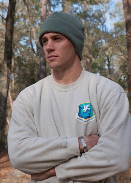 U.S. Air Force Tech. Sgt. Dallas Bozeman, 820th Combat Operations Squadron explosive ordnance disposal technician, stands amid members of his squadron as they carry out a scenario created by Bozeman at the military operations in urban terrain village Feb. 8, 2012, at Moody Air Force base, Ga. Bozeman deploys six months out of the year, and when not deployed, trains the 820th Base Defense Group counter improvised explosive devise tactics. (U.S. Air Force photo by Senior Airman Eileen Meier/Released) 