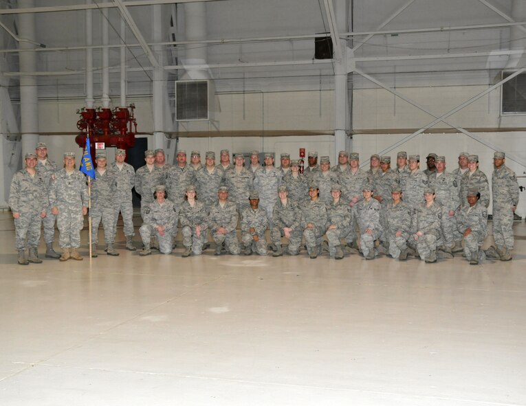 The 126th Supply Chain Management Squadron was recognized for receiving the Air Force Outstanding Unit Award (AFOUA) in a parade ceremony at Scott AFB, Ill., on Feb. 4, 2012.  Army Maj. Gen. William Enyart, Adjutant General, State of Illinois; Air Force Brig. Gen. James Schroeder, Commander, Illinois Air National Guard; and Air Force Col. Peter Nezamis, Commander, 126th Air Refueling Wing; followed military tradition and ceremoniously attached the AFOUA streamer to the squadron’s guidon in the formal ceremony attended by more than 830 members of the 126th Air Refueling Wing and guests.  The 126th Supply Chain Management Squadron is commanded by Air Force Maj. Evan Cozadd and the squadron received the award for exceptionally meritorious service from Aug. 1, 2009 through Sept. 30, 2011. (U,S. Air Force photo by Master Sgt. Franklin Hayes)