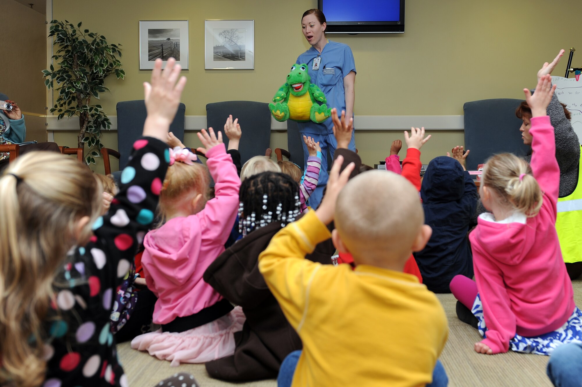 U.S. Air Force Staff Sgt. Heather Jordan, 23d Aerospace Medicine Squadron dental technician, speaks to a pre-school class from the Child Development Center at Moody Air Force Base, Ga., Feb. 8, 2012. The children visited the clinic to learn about dental health and hygiene. (U.S. Air Force photo by Staff Sgt. Ciara Wymbs/Released)
