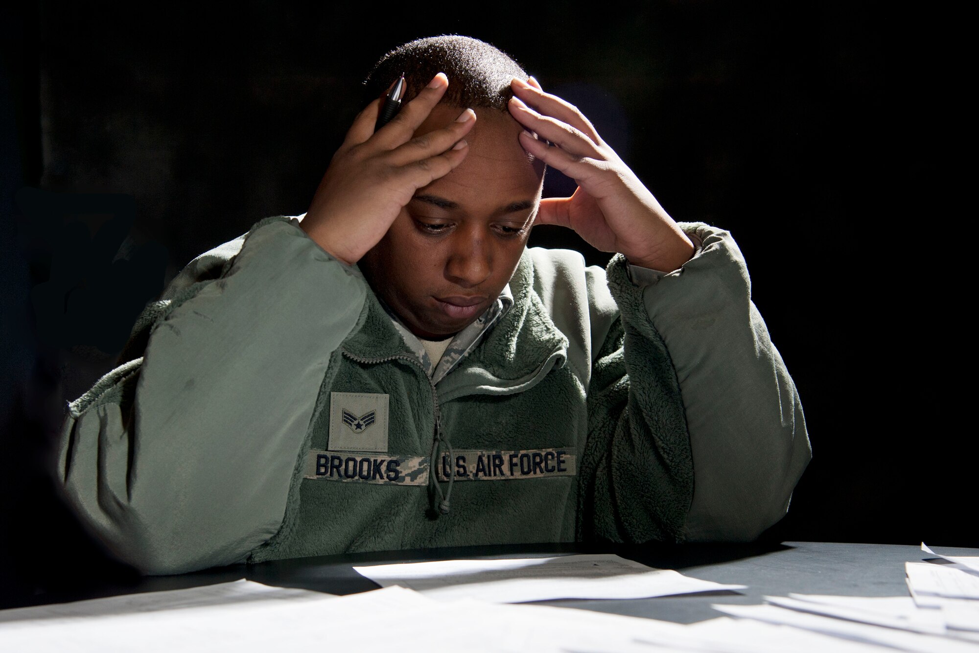 Senior Airman Michael Brooks, 49th Logistics Readiness Squadron, attempts to file his 2011 taxes on his own. Brooks could have saved himself a lot of time and energy by filing his taxes with the Holloman Tax Center located in the Community Activities Center on base. (U.S. Air Force Photo illustration by Airman 1st Class Anthony M. Ward)