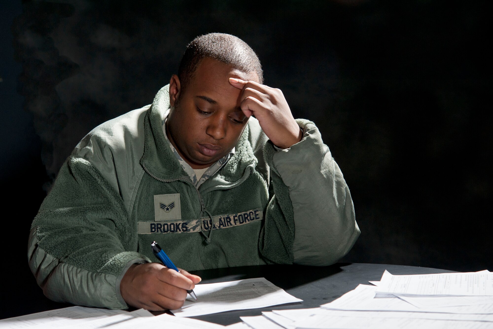 Senior Airman Michael Brooks, 49th Logistics Readiness Squadron, attempts to file his 2011 taxes on his own. Brooks could have saved himself a lot of time and energy by filing his taxes with the Holloman Tax Center located in the Community Activities Center on base. (U.S. Air Force Photo illustration by Airman 1st Class Anthony M. Ward)