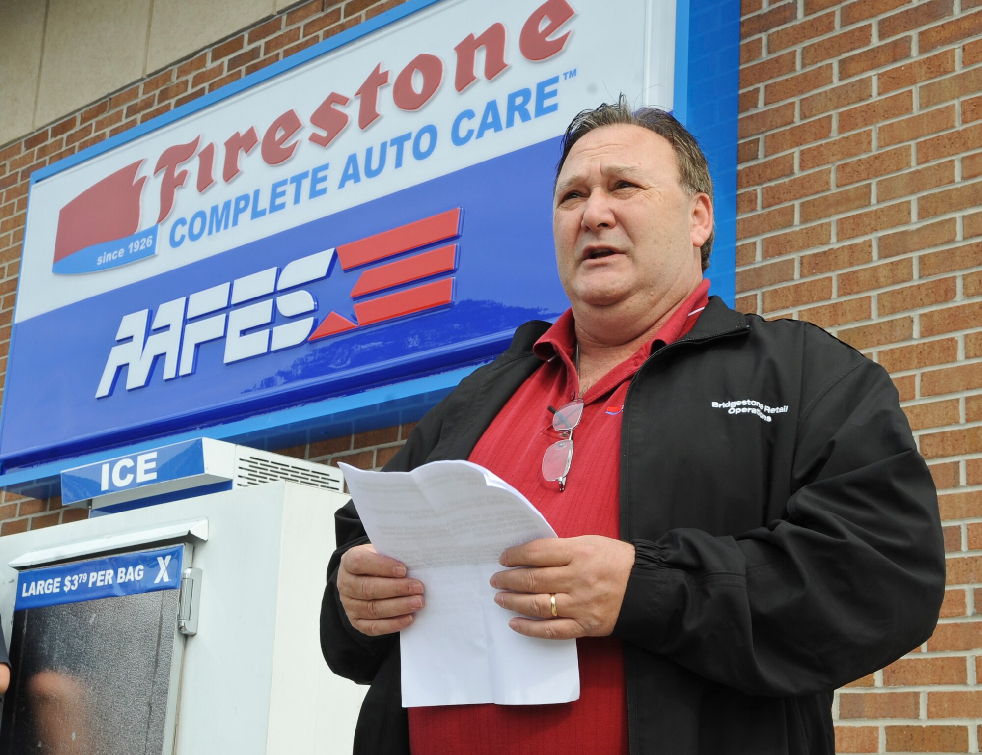 Ron DeMario, Bridgestone retail operator, gives opening remarks during the grand opening of the Firestone Complete Auto Care Center at Moody Air Force Base, Ga., Feb. 7, 2012. The auto center is an auto maintenance and repair shop offering car repair, tire replacement, brake services, tune ups, oil changes and more. (U.S. Air Force photo by Airman 1st Class Olivia Dominique/Released)
