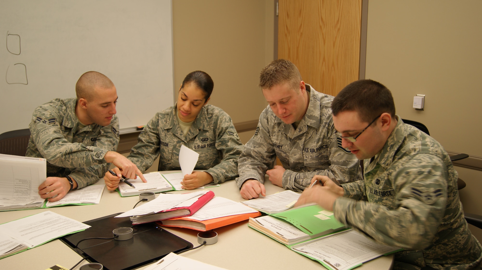 These contracting career field Airmen recently completed the first training class at Rock Island Arsenal, Ill., of an innovative joint CONUS-based project between the Air Force Enterprise Sourcing Group, CENTCOM – Joint Theater Support Contracting Command and Army Contracting Command – Rock Island.  Left to right: Airman 1st Class Jacob C. Henningsgaard, 771 ESS/EGA, Airman 1st Class Keisha N. Robinson, 771 ESS/EGB; Staff Sgt. Justin P. Keeney, 771 ESS/EGB; Airman 1st Class Christopher J. Rudolf, 771 ESS/EGC.  