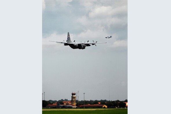 Two C-130 Hercules aircraft circle the flightline at Maxwell Air Force Base while a third prepares to taxi towards the runway. According to a recent Air Force announcement, the seven transport aircraft belonging to the 908th Airlift Wing are to be retired. Although the unit will remain functional, members are concerned about the future, as any possible unit organization and mission have yet to be decided.
