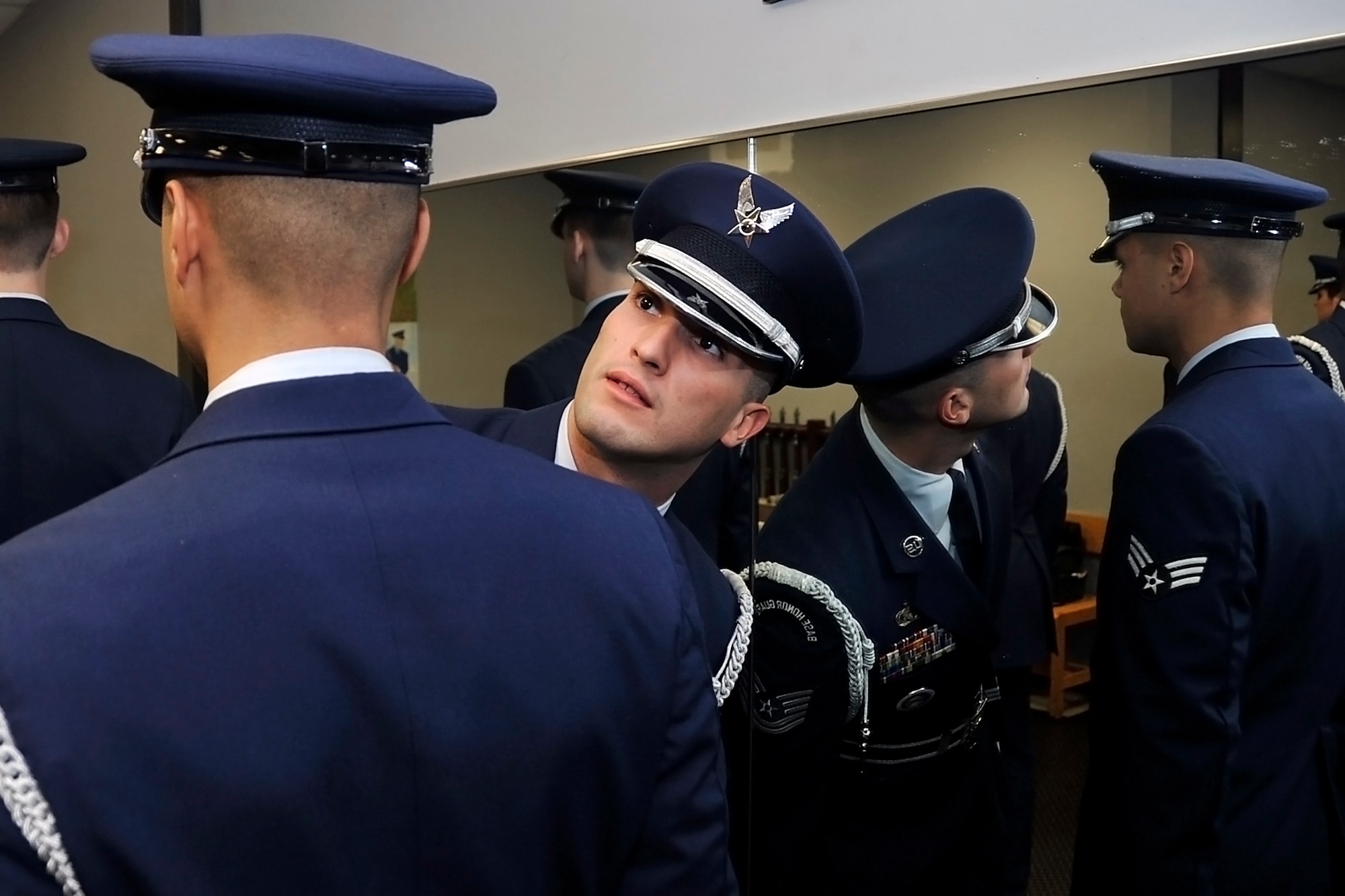 Tech. Sgt. Jared Lacovara, 88th Aerial Port Squadron, performs a uniform inspection on a member of the 87th Air Base Wing honor guard. Lacovara, who was trained by the Air Force honor guard at Bolling Air Force Base, Md., is passing-on that training to his active-duty counterparts. (U.S. Air Force photo by Shawn J. Jones)