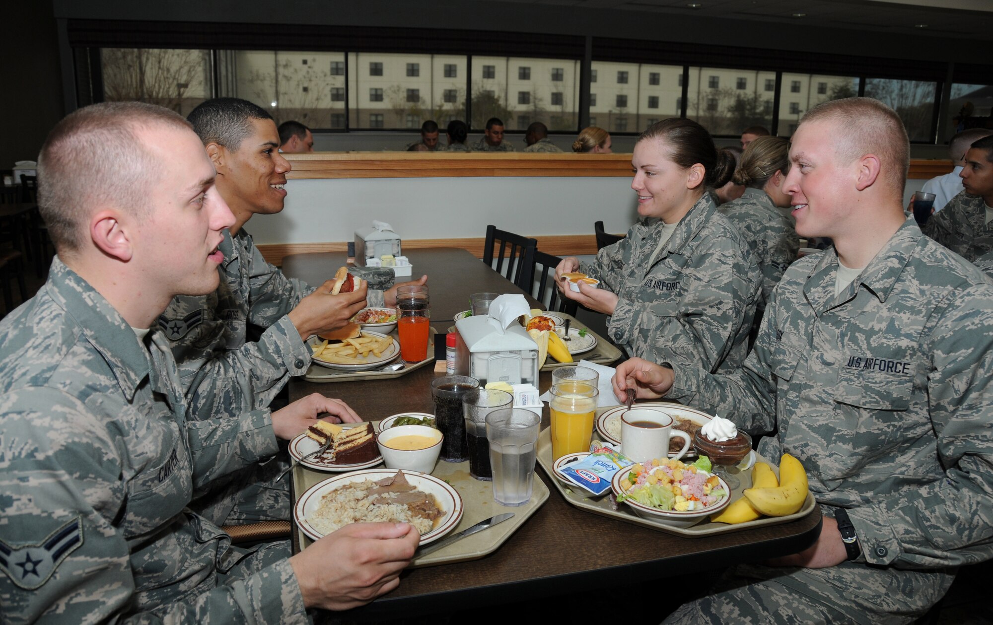 Airmen 1st Class Matthew Carter and Skyler Ross, Airman Basic Destiny Boggs, and Airman 1st Class Cody Fox, 334th Training Squadron, eat lunch at the Azalea Dining Facility, Keesler Air Force Base, Miss., Feb. 6, 2012.  Keesler is this year’s Air Education and Training Command nominee for the John L. Hennessy Award as the top food service operation in the Air Force in the multiple facility category..  (U.S. Air Force photo by Kemberly Groue)