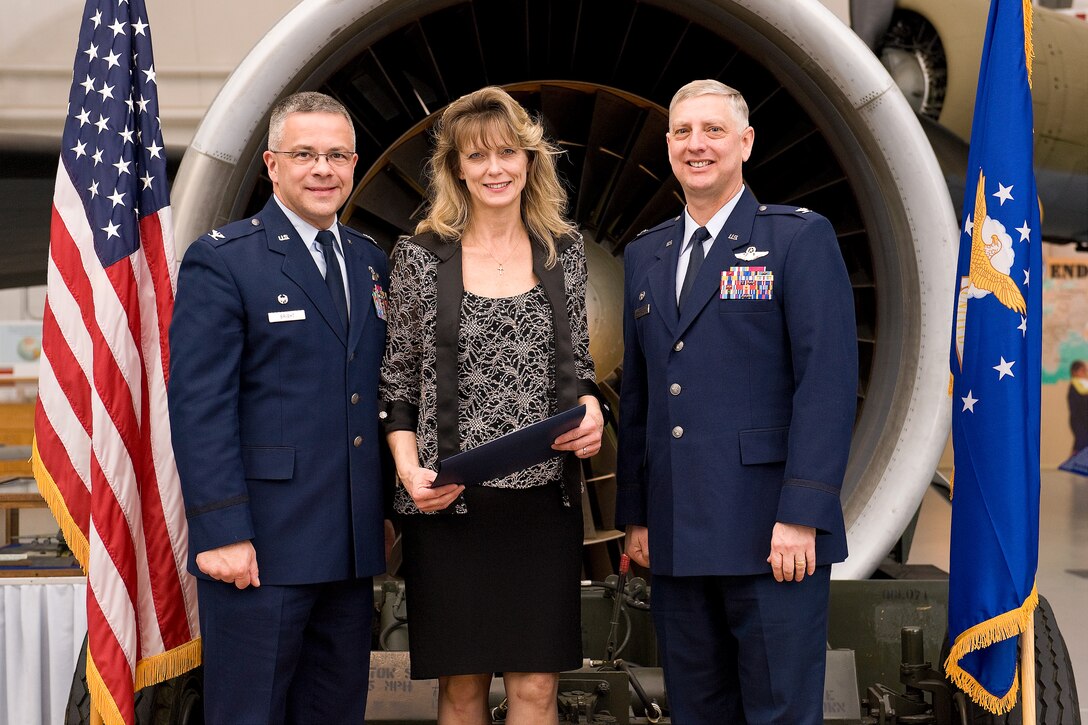 Commanders from the 436th and 512th Airlift Wings, Air Force Mortuary Affairs Operations, and Joint Personal Effects Depot recognize outgoing honorary commanders and induct new local community leaders during the Honorary Commander Induction Ceremony Feb. 4, 2012, at Dover Air Force Base, Del., Air Mobility Command Museum. 2011 honorary commanders were inducted as honorary commanders alumni. Cols. Mark D. Camerer and Randal L Bright administered the honorary commander's oath to incoming 2012 honorary commanders. Dr. Stphanie Steckel, 2011 honorary commander, was the guest speaker for the event. (U.S. Air Force photo/Roland Balik)