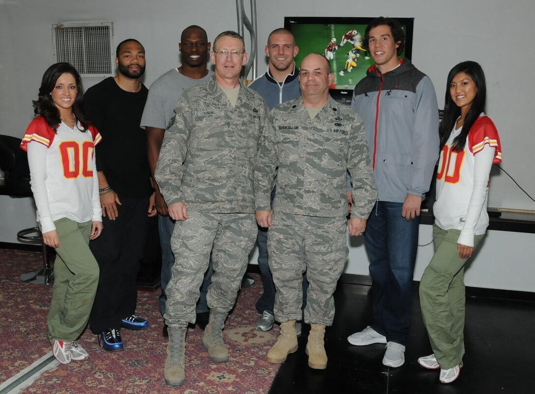 Deployed 932nd Airlift Wing members Master Sgt. Tony Loving and Lt. Col. Andrew Chancellor had a chance to meet several NFL players while overseas. 

"The United Service Organizations (USO) sponsored an NFL day at our location.  There was a meet and greet followed by a punt pass and a kick competition.  We were visited by Sam Bradford, quarterback for the Rams, James Laurinaitis, linebacker for the Rams; Seneca Wallace, quarterback for the Browns, and Rocky McIntosh, Washington Redskins linebacker, along with two Kansas City Chiefs cheerleaders.  Two weeks ago I got to see the Lt. Dan Band, with Gary Sinese.  That was an outstanding show.  One of the best parts about being deployed is the entertainment that comes through here," said Sergeant Loving.  (Photo submitted by Sergeant Loving)