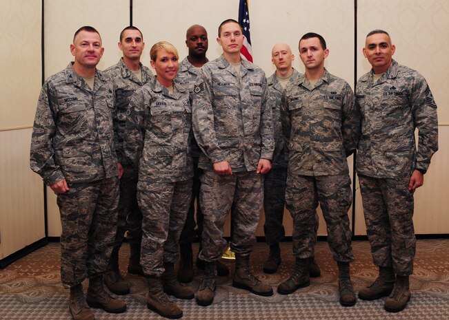Colonel Richard McComb (left) and Chief Master Sgt. Jose LugoSantiago (right) recognize February's Diamond Sharp winners at the Charleston Club at Joint Base Charleston –Air Base, Feb. 7. The Diamond Sharp recipients are (front row from left) Senior Airman Taylor Savage, 628th Medical Group, Staff Sgt. Aaron Hellman 373rd Training Squadron, and Airman 1st Class Tom Brading, 628th Air Base Wing Public Affairs. Pictured with the Diamond Sharp winners are Master Sgt. Christopher Robinson, 628th MDG, Master Sgt. Julius Walker, 373rd TRS Squadron and Master Sgt. John Gott, 628th ABW /PA. Diamond Sharp awardees are Airmen chosen by their first sergeants for their excellent performance. McComb is the JB Charleston commander and LugoSantiago is the JB Charleston command chief. (U.S. Air Force photo/Staff Sgt. Katie Gieratz)

