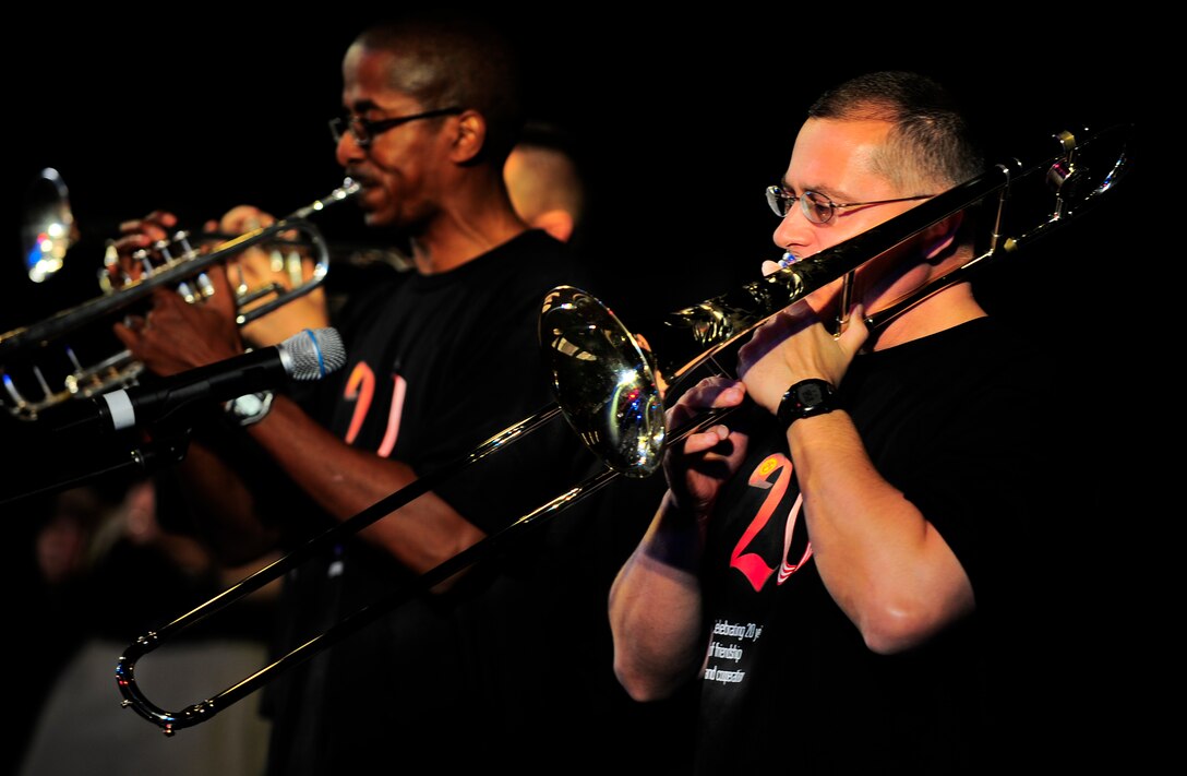 Staff Sgt. William Harris (R) plays trombone and Staff Sgt. Quincy Garner plays trumpet Feb. 7, 2012, during the U.S. Air Forces Central Band Afterburner concert at the Russian Drama Theater in Bishkek, Kyrgyzstan. Afterburner is a classic rock band consisting of nine Airmen deployed from Hanscom Air Force Base.(U.S. Air Force Photo/Staff Sgt. Angela Ruiz)