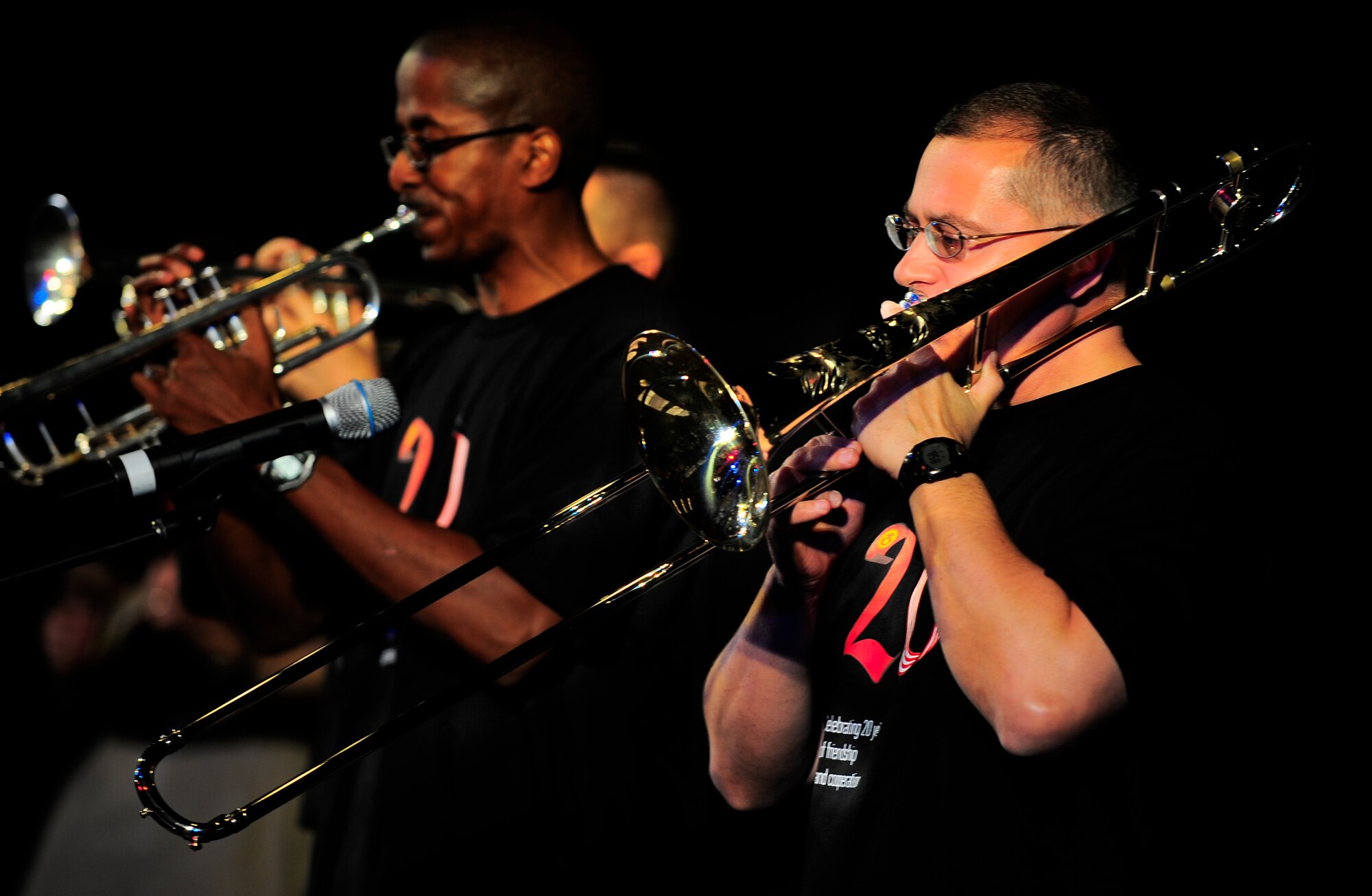Staff Sgt. William Harris (R) plays trombone and Staff Sgt. Quincy Garner plays trumpet Feb. 7, 2012, during the U.S. Air Forces Central Band Afterburner concert at the Russian Drama Theater in Bishkek, Kyrgyzstan. Afterburner is a classic rock band consisting of nine Airmen deployed from Hanscom Air Force Base.(U.S. Air Force Photo/Staff Sgt. Angela Ruiz)