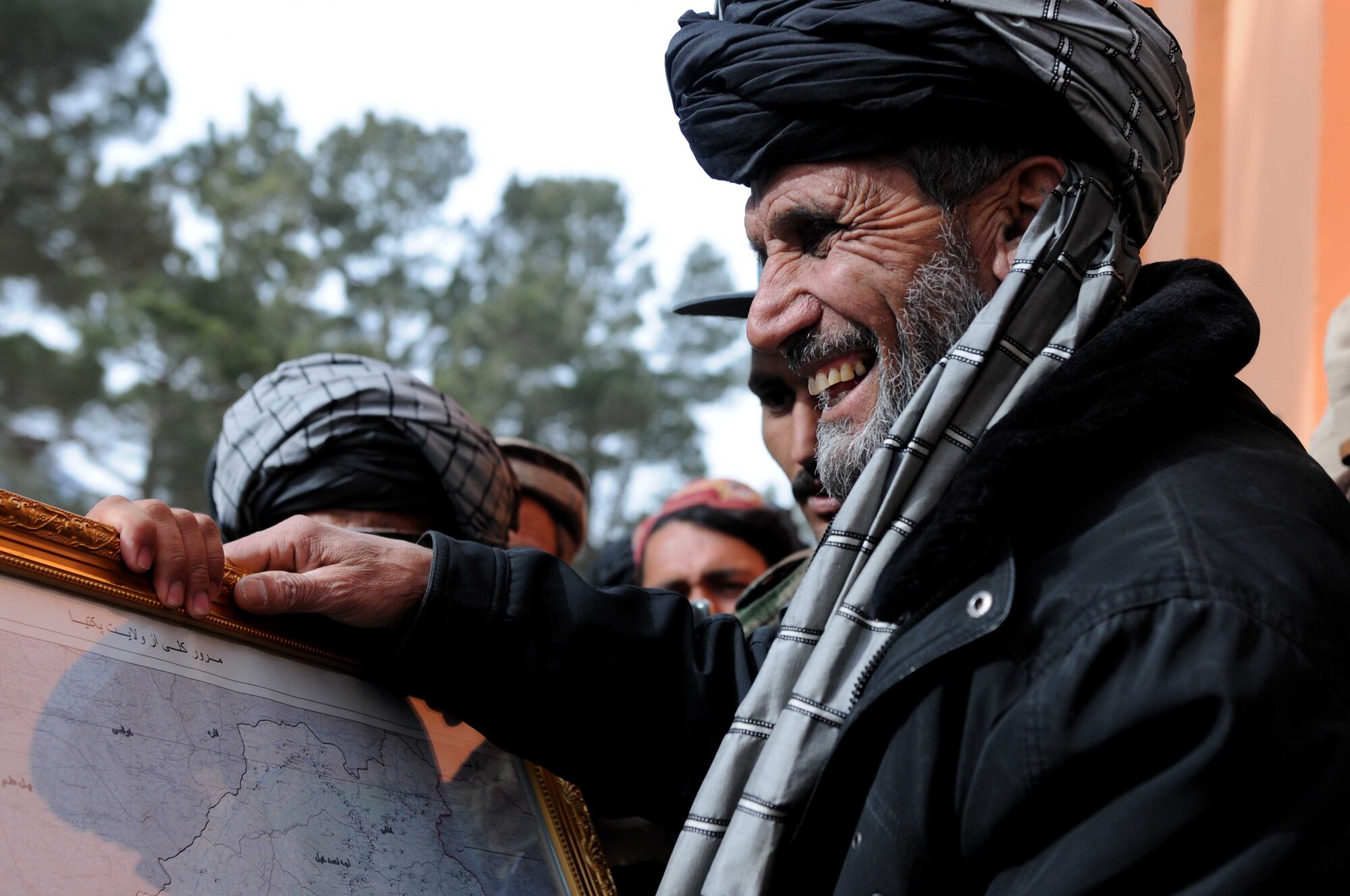 PAKTYA PROVINCE, Afghanistan— Said Mohammad, Chamkani district sub governor, recieves a map of Paktya Province during a district center ribbon-cutting ceremony in Paktya Province, Afghanistan, Feb 1. Anti-government forces attached the district center in November, and reconstruction efforts began almost immediately. (U.S. Air Force photo by 1st Lt Cammie Quinn, Paktya Provincial Reconstruction Team Public Affairs) 
