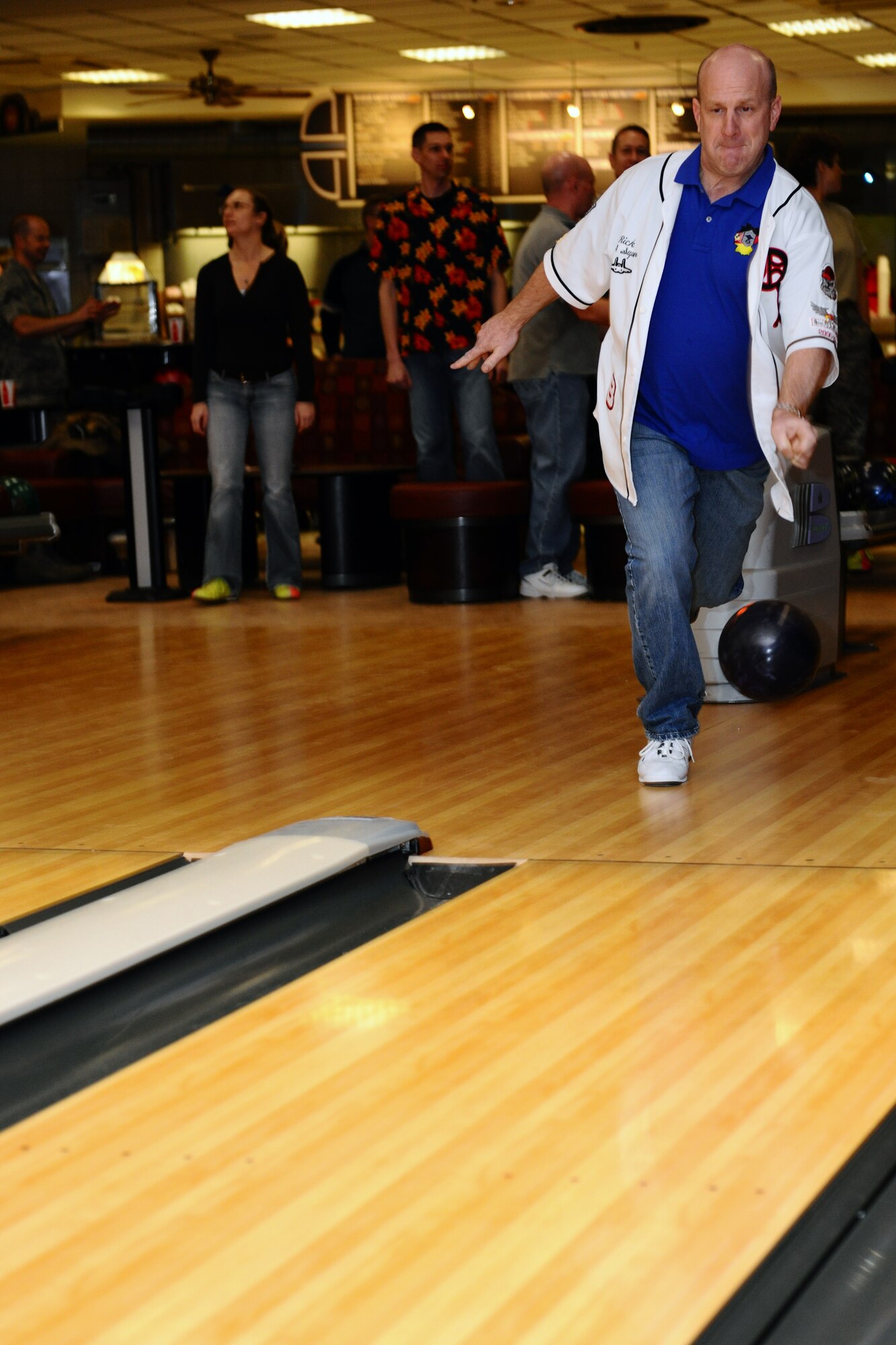 SPANGDAHLEM AIR BASE, Germany – Chief Master Sgt. Ricky Owen, 52nd Equipment Maintenance Squadron chief, throws a bowling ball down a lane during the “Commanders vs. Chiefs” bowling tournament inside the Eifel Lanes Bowling Center here Feb. 3. The chiefs surmounted the commanders with a total score of 1491 - 1443. The tournament allows enlisted and commissioned leaders to compete with one another in a friendly environment outside of work while helping build morale and camaraderie. (U.S. Air Force photo by Airman 1st Class Dillon Davis/Released)