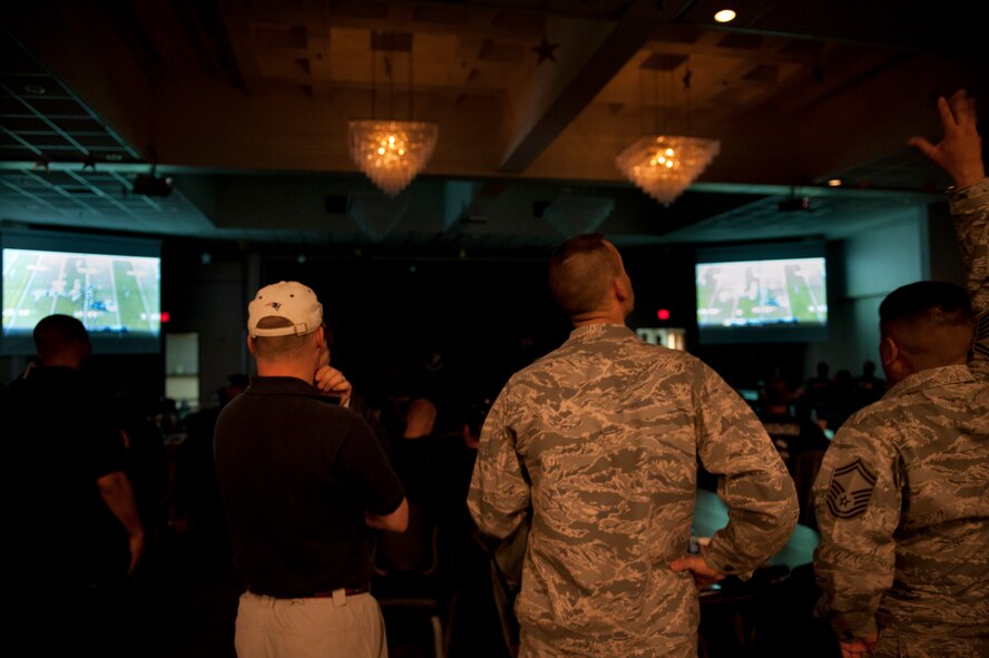 Spectators watch Super Bowl XLVI Feb. 6, 2012, at the Club Complex ballroom at Incirlik Air Base, Turkey. The 39th Force Support Squadron-sponsored event featured a commercial contest that awarded $3,000 in wing funds to the winning unit. The 39th FSS won first and third place, winning $3,000 and $1,000, respectively; the 39th Maintenance Squadron won second, winning $2,000; and the individual category submission was from Nathan Kaw-Uh, who won a $100 voucher toward an Outdoor Recreation Connection trip. (U.S. Air Force photo by Tech. Sgt. Michael B. Keller/Released)
