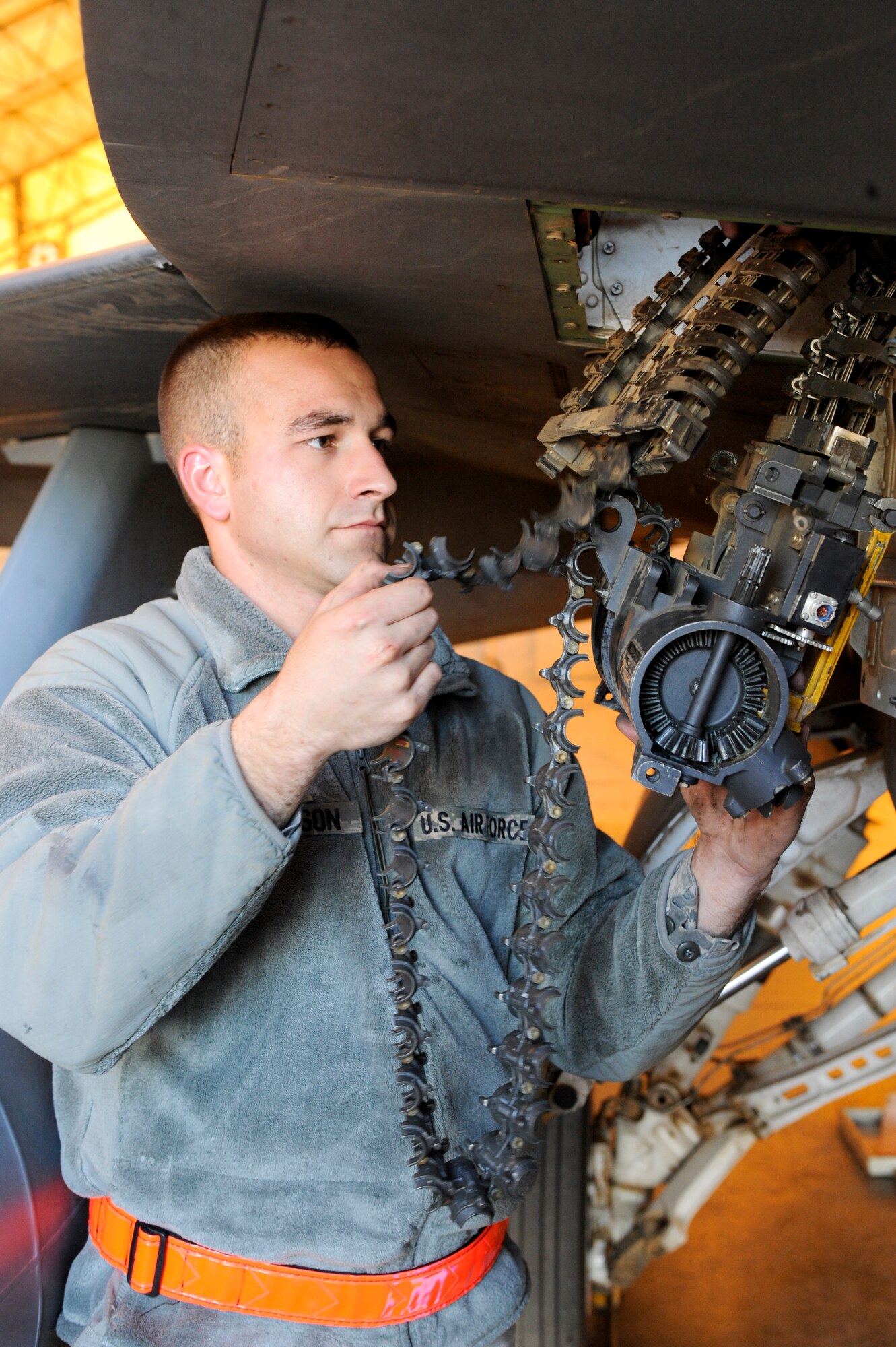 Staff Sgt. Gregory Harrison, 332nd Expeditionary Aircraft Maintenance Squadron weapons load crew chief, removes the gun system access unit from an F-16 Fighting Falcon at an undisclosed location in Southwest Asia, Feb. 5, 2012. The access unit allows Harrison to load bullets into the ammunition drum. Harrison is deployed from Shaw Air Force Base, S.C., and is a native of Fence, Wis. (U.S. Air Force photo by Staff Sgt. Joshua J. Garcia/Released)