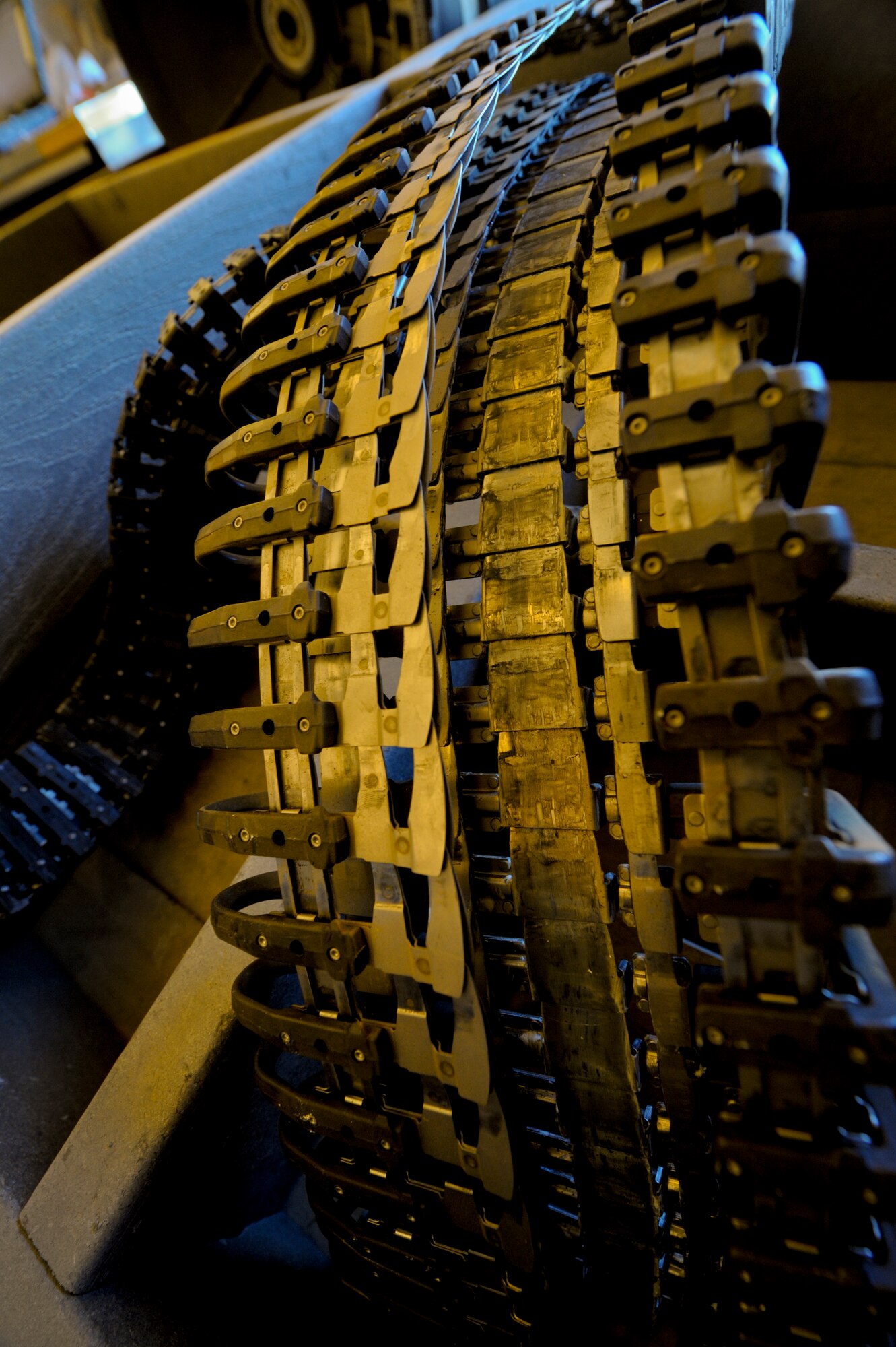 The universal ammunition loading system for an F-16 Fighting Falcon sits outside of the aircraft as the gun is removed for an inspection at an undisclosed location in Southwest Asia, Feb. 5, 2012. The loading system is used to load and remove bullets from the gun. (U.S. Air Force photo by Staff Sgt. Joshua J. Garcia/Released)