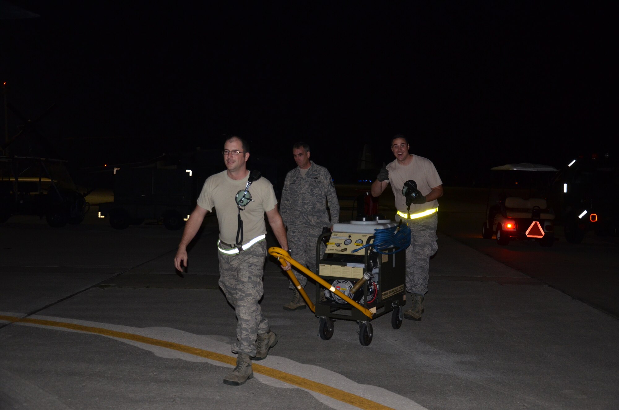 Maintenance Airmen from the 920th Rescue Wing, Patrick Air Force Base, Fla., recover an HH-60G Pave Hawk helicopter after it landed from a real-world rescue mission during a night training event. The maintainers service the aircraft and ensure its rescue-ready at a moment's notice. (U.S. Air Force photo/Capt. Cathleen Snow)