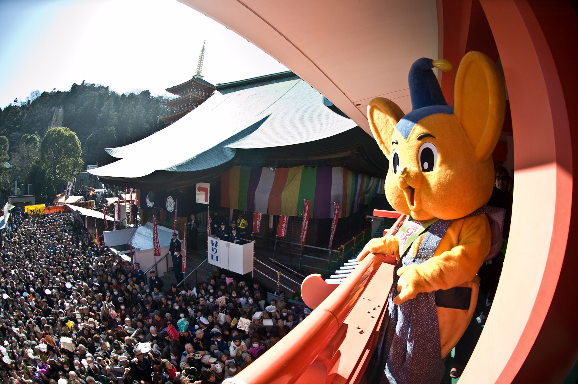 HINO CITY, Japan -- Pipo-kun, the mascot for the Metropolitan Police Department, greets the crowd while waiting for the start of the Bean Throwing Ceremony at the Takahata Fudo Temple in Hino City, Japan, Feb. 3, 2012. The ceremony is an annual event held to celebrate the start of a new year with prospect and good fortune. (U.S. Air Force photo/Airman 1st Class Krystal M. Garrett)