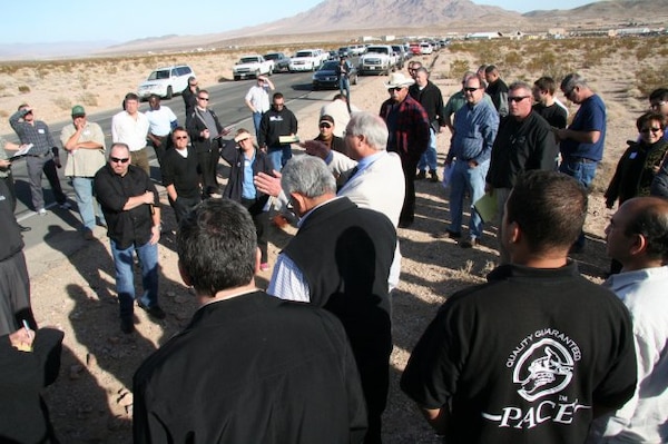 Randi Elder, a project manager with the U.S. Army Corps of Engineers Los Angeles District's Fort Irwin Office, (center, white sport coat), briefs potential offerors about the Fort Irwin Replacement Hospital during a site visit. The Barstow Area Chamber of Commerce, along with officials from the National Training Center, Fort Irwin and the District, held a day-long meet and greet and project overview for the Fort Irwin Replacement Hospital.