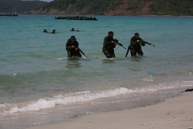 Marines from Battalion Landing Team 1st Battalion, 4th Marine Regiment, 31st Marine Expeditionary Unit, advance on a beach during the Royal Thai, U.S. bilateral boat raid here Feb. 07. The Marines conducted this training during Exercise Cobra Gold 2012, the 31st iteration of an annual multilateral exercise designed to increase interoperability with participating nations in the Asia-Pacific region. (U.S. Marine Corps photo by Cpl Justin R. Wheeler/released)