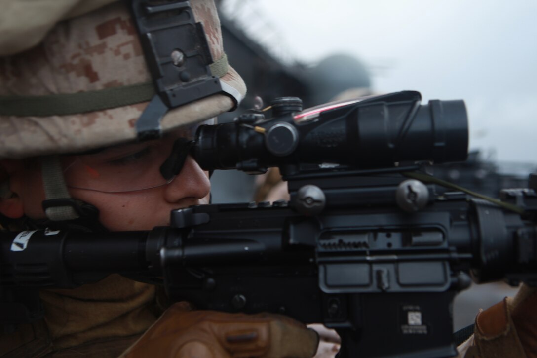 Lance Cpl. Gregory J. Manuel fires an M4 carbine aboard USS Makin Island Feb. 8. The rifleman serves with the 11th Marine Expeditionary Unit's maritime raid force. The unit is deployed as part of the Makin Island Amphibious Ready Group, a U.S. Central Command theater reserve force. The group is providing support for maritime security operations and theater security cooperation efforts in the U.S. Navy's 5th Fleet area of responsibility.