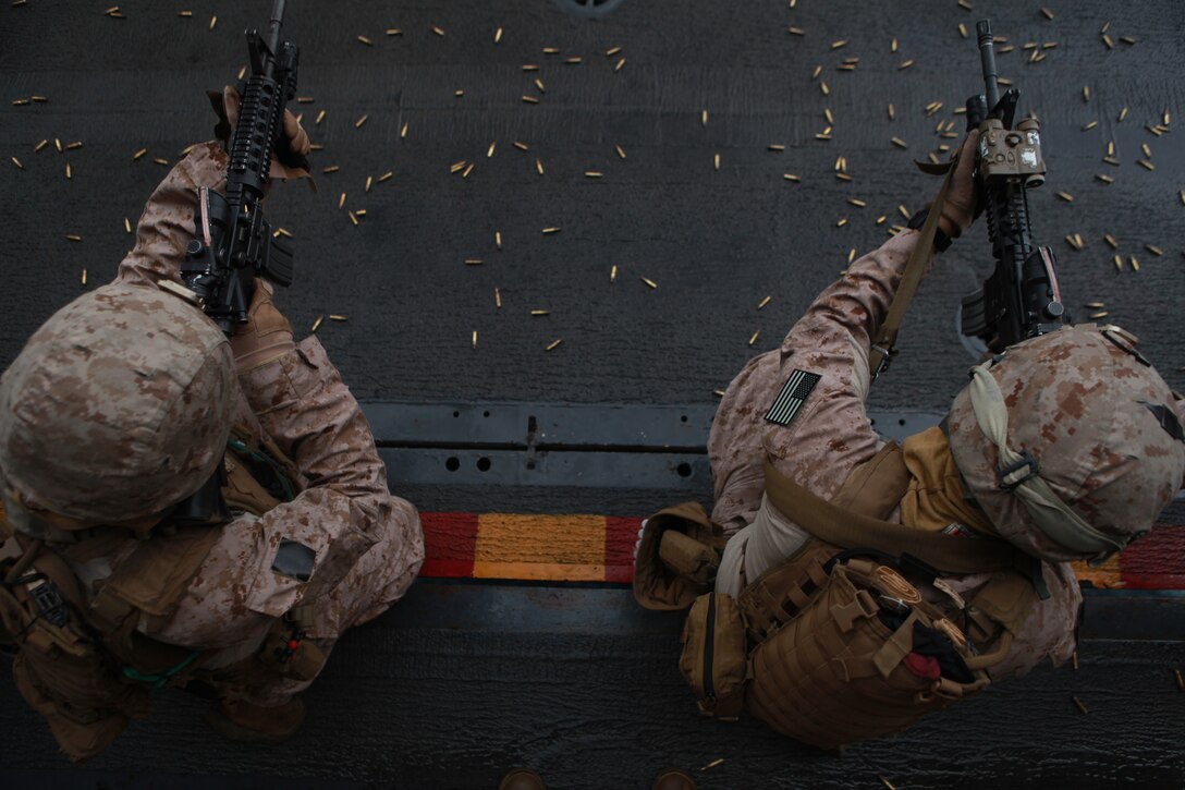 – Marines with the 11th Marine Expeditionary Unit's maritime raid force fire M4 carbines at training targets aboard USS Makin Island Feb. 8. The unit is deployed as part of the Makin Island Amphibious Ready Group, a U.S. Central Command theater reserve force. The group is providing support for maritime security operations and theater security cooperation efforts in the U.S. Navy's 5th Fleet area of responsibility.