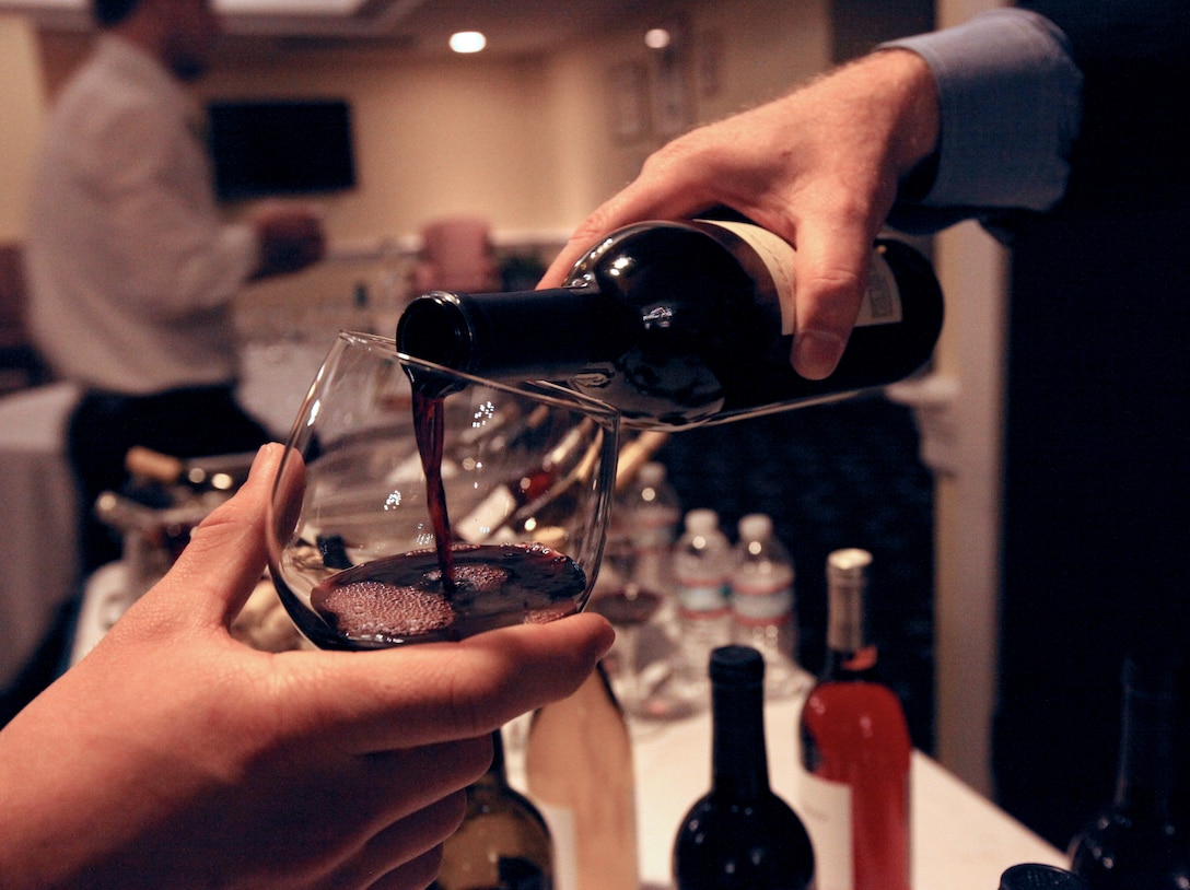 An assortment of wines were pour into glasses during the Wine Tasting event held at the Paradise Point Officers’ Club aboard MCB Camp Lejeune, recently. The owners of Edward and Sophie Rollat winery brought six different types of wine that offered a flavorful variety to taste buds.