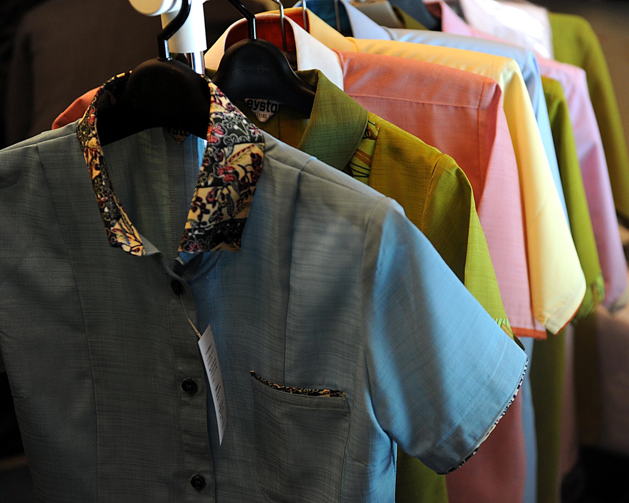 Shirts from Keystone tailor, a local Okinawan business, hang on display during the second annual Okinawa First Vendor Showcase in Okinawa, Japan, Feb. 3, 2012. The showcase is to allow military members the opportunity to view the possibilities of what can be purchased locally instead of having supplies shipped from the United States. (U.S. Air Force photo by Airman 1st Class Brooke P. Beers/Released)