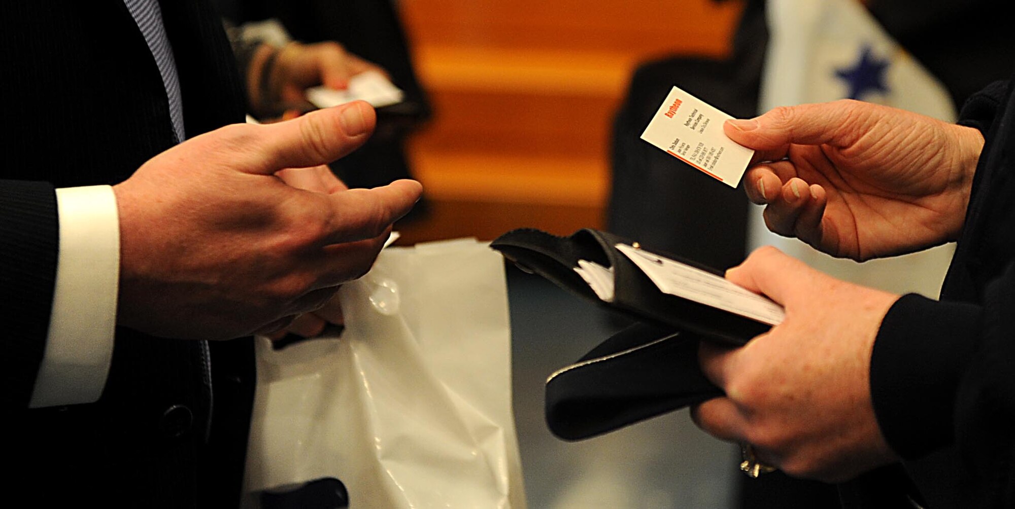 U.S. Air Force Maj. Gen. Wendy Masiello, deputy assistant secretary for contracting, Office of the Assistant Secretary of the Air Force for Acquisition, Washington, D.C., exchanges business cards with Okinawan vendors during the second annual Okinawa First Vendor Showcase in Okinawa, Japan, Feb. 3, 2012. Maj. Gen. Masiello is responsible for all aspects of contracting relating to the acquisition of weapons systems, logistics, operational and contingency support for the U.S. Air Force. (U.S. Air Force photo by Airman 1st Class Brooke P. Beers/Released)