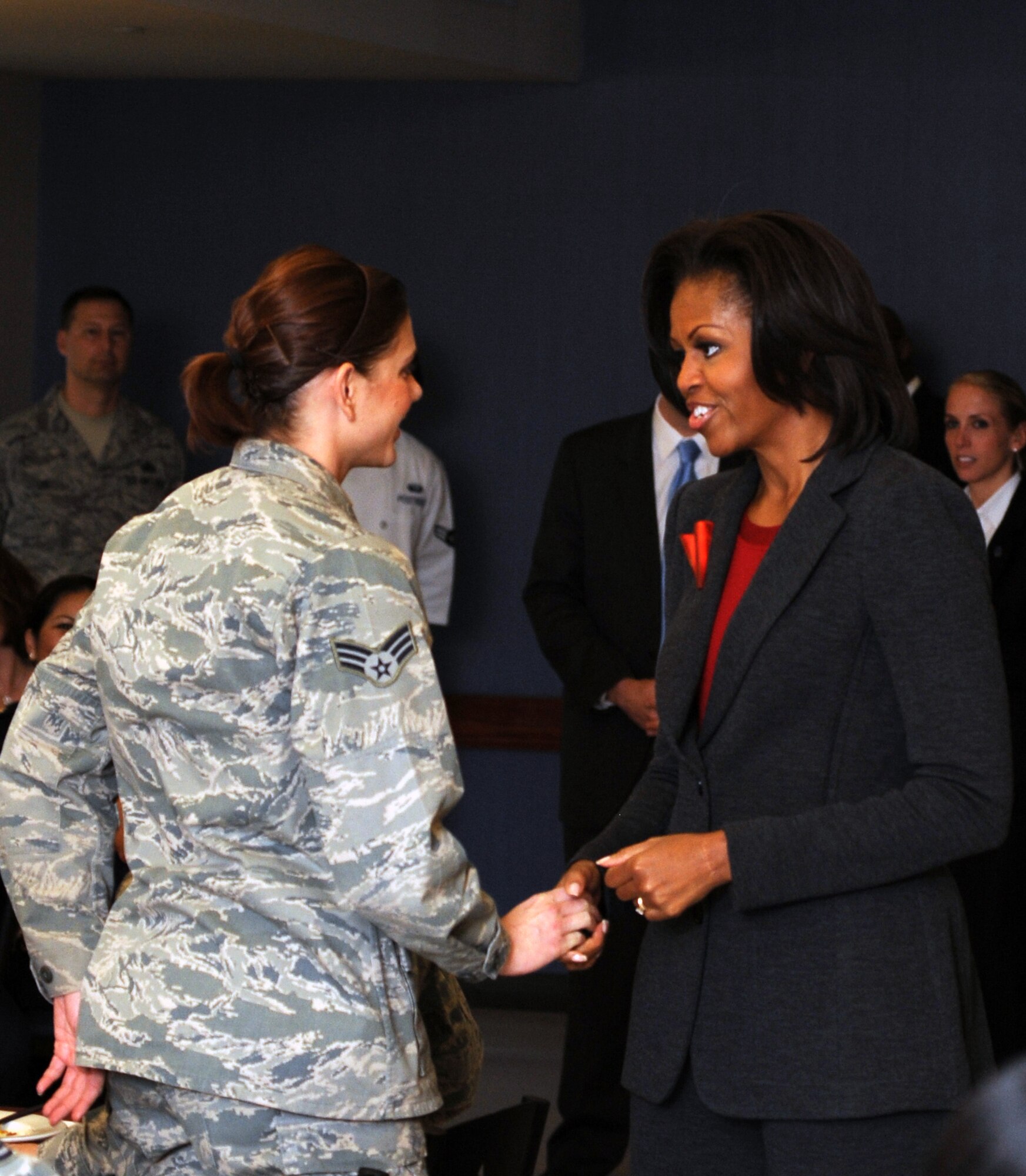 First Lady Michelle Obama speaks to a Team Little Rock Member, Feb. 9, 2012 at Little Rock Air Force Base, Ark. . Little Rock Air Force Base is one of 6 bases to implement the pilot food transformation initiative program, a program designed to provide a wider variety of nutritional meals to service members and their families. (U.S. Air Force Photo by Airman 1st Class Rusty Frank)
